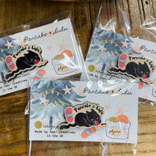 Load image into Gallery viewer, Packaged pins with a Pancake and Lulu branding, featuring a black kitty design, displayed on a wooden surface.